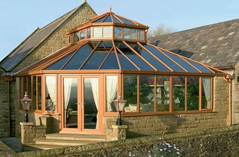 A large conservatory with a glass roof.