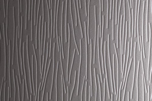 A close up image of a grey wall with a pattern.