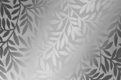 A white and silver wallpaper with leaves on it.