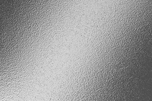 A black and white image of a metal surface.