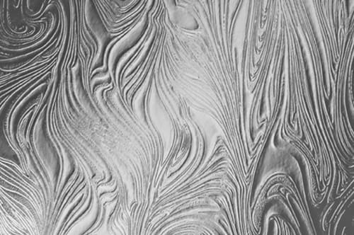 A black and white photo of a wavy pattern.